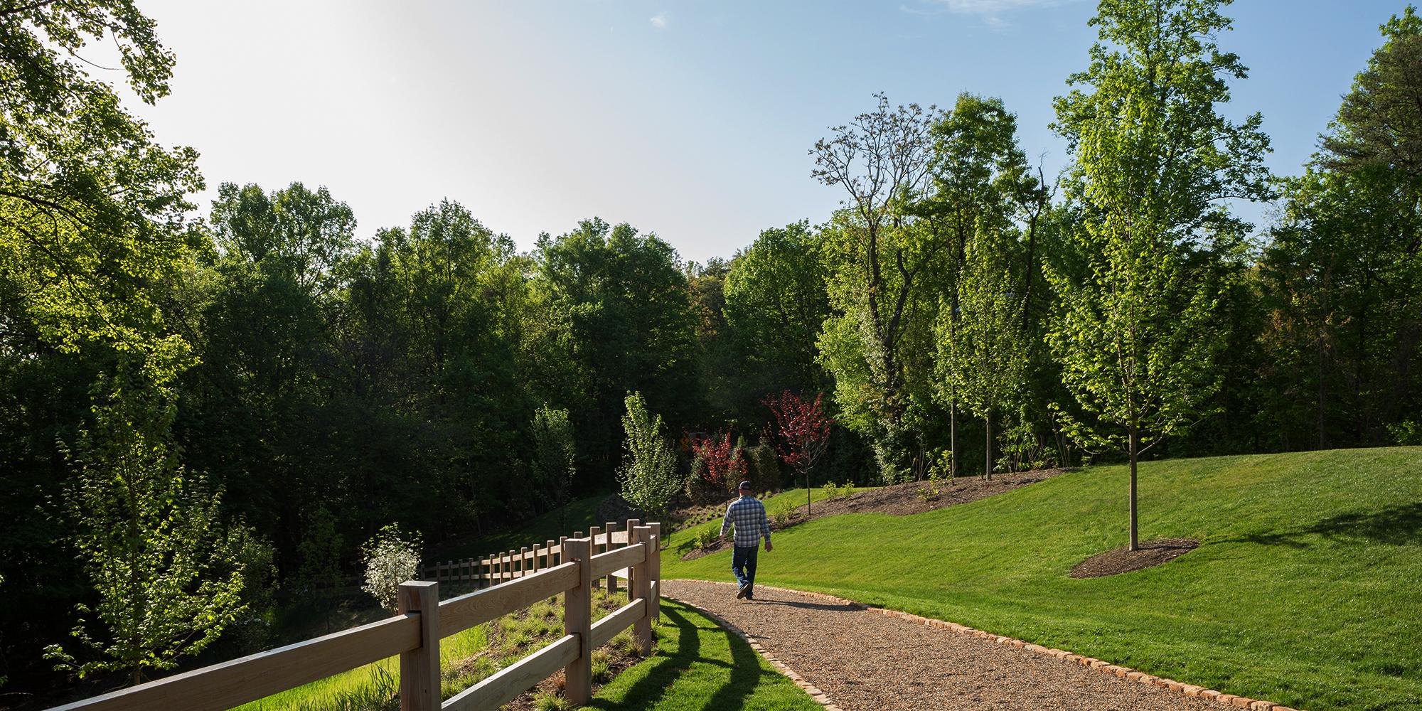 Man walking through High Ground Park